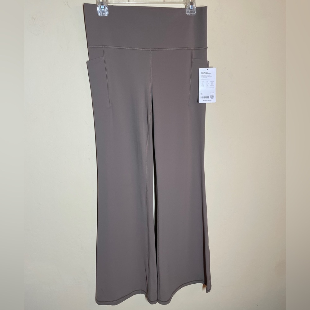 NWT Athleta Salutation Stash Flare Pant. Large - Picture 2 of 10